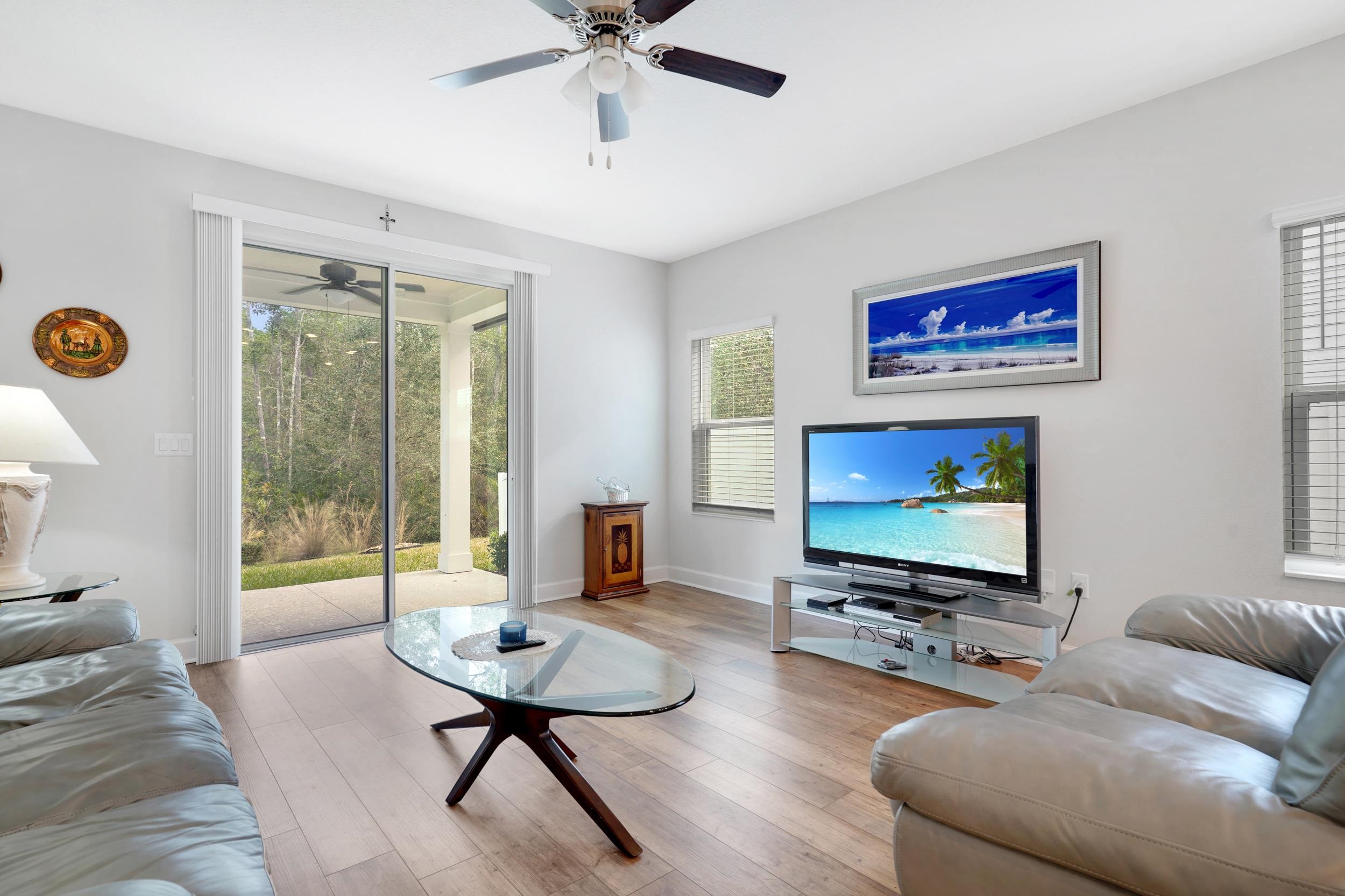 1014 Morgans Treasure Road St. Augustine, FL 32084 - Photo 9 of 31 a living room with furniture and a flat screen tv