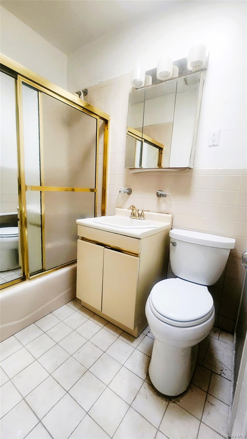 664 Remsen Avenue Brooklyn, NY 11236 - Photo 32 of 40 a bathroom with a sink toilet and shower