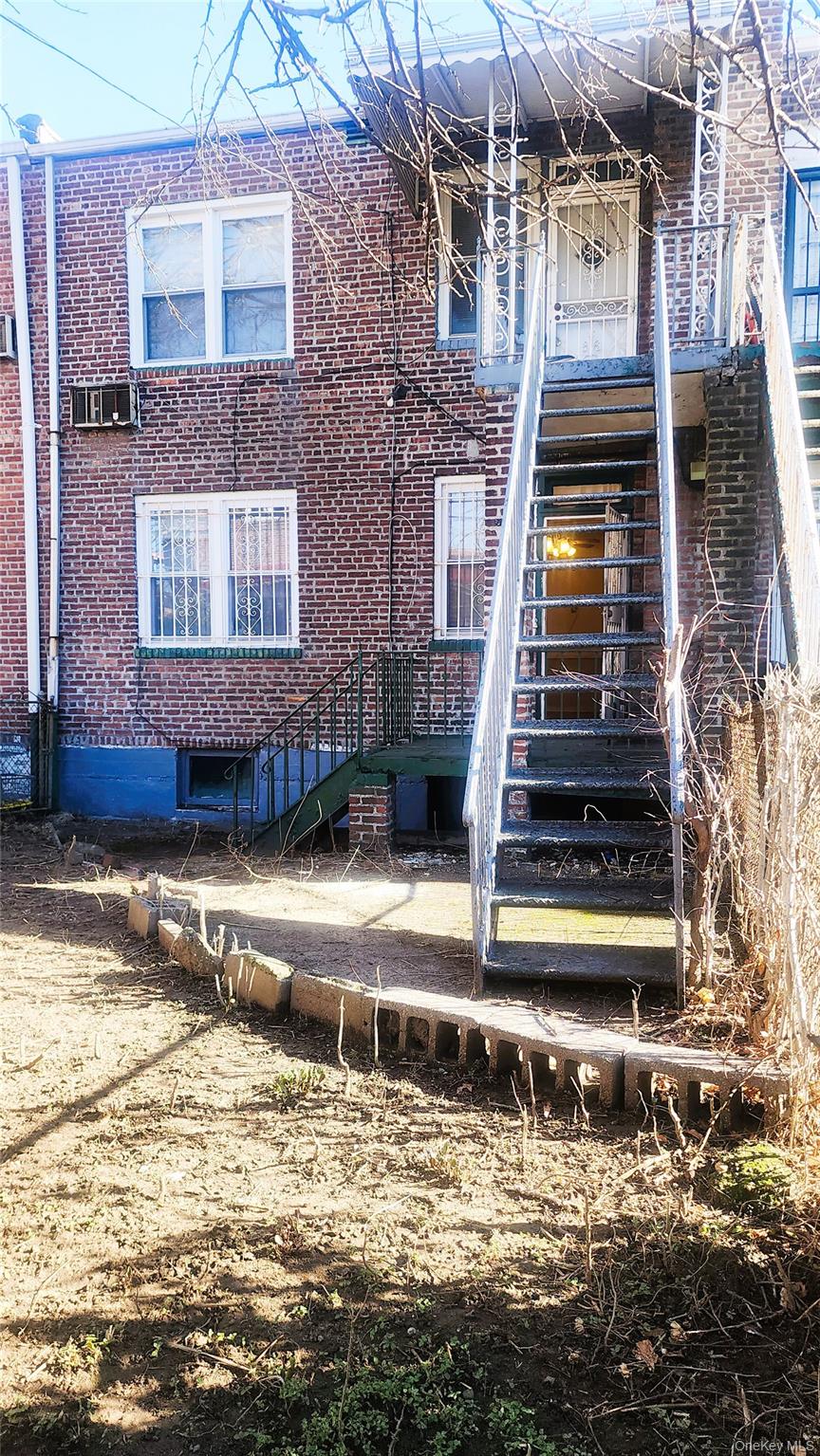 664 Remsen Avenue Brooklyn, NY 11236 - Photo 37 of 40 a front view of a house with a yard