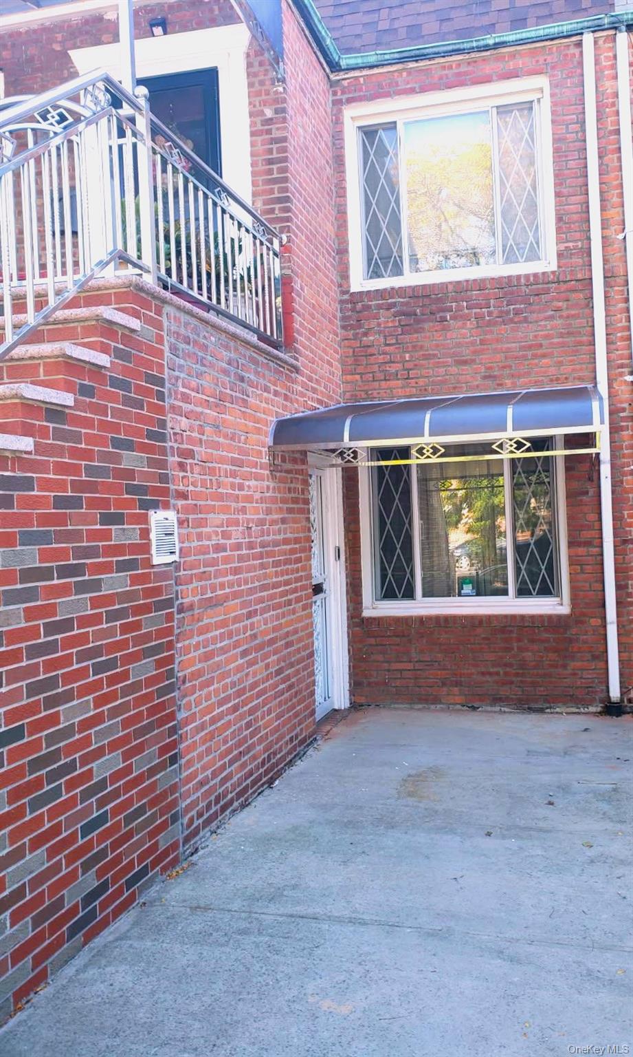 664 Remsen Avenue Brooklyn, NY 11236 - Photo 8 of 40 a view of a brick house with many windows