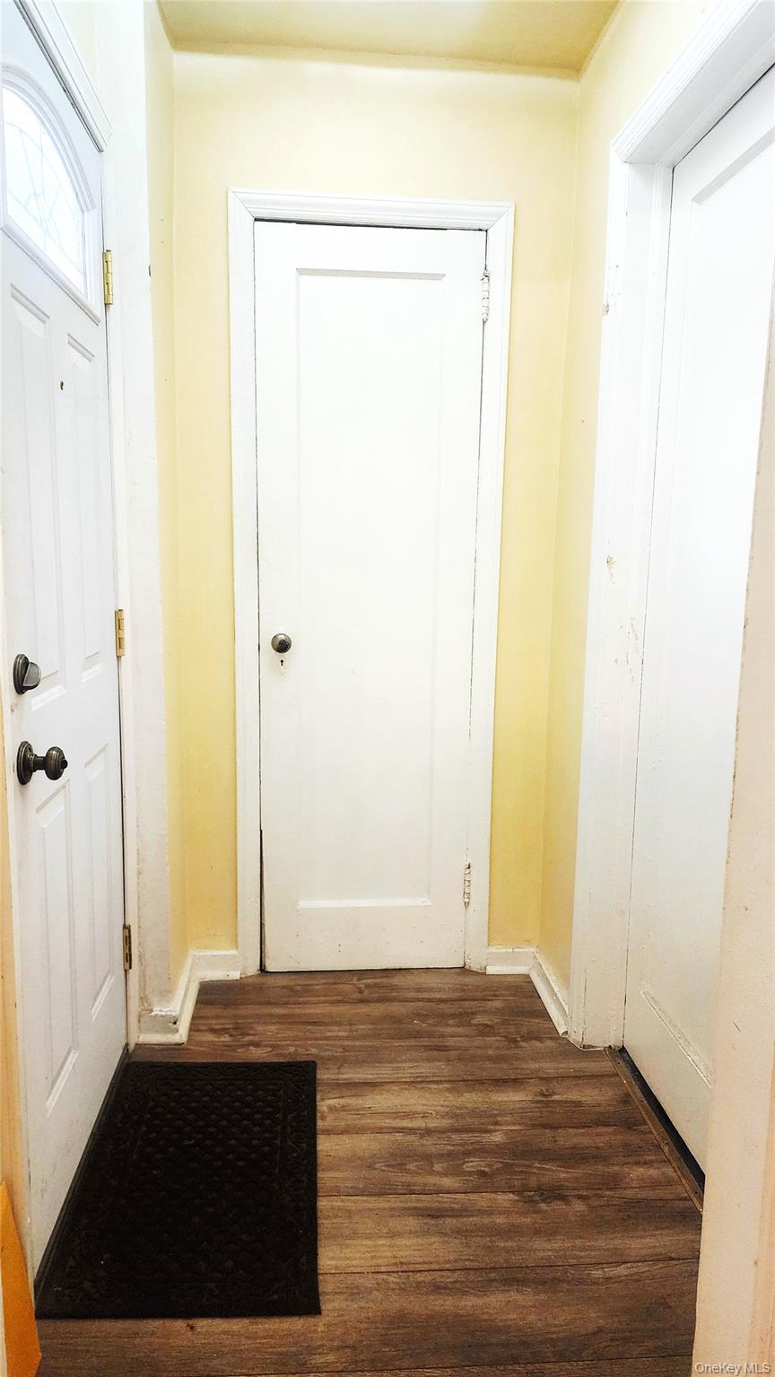 664 Remsen Avenue Brooklyn, NY 11236 - Photo 9 of 40 a view of a room with wooden floor and a bathroom