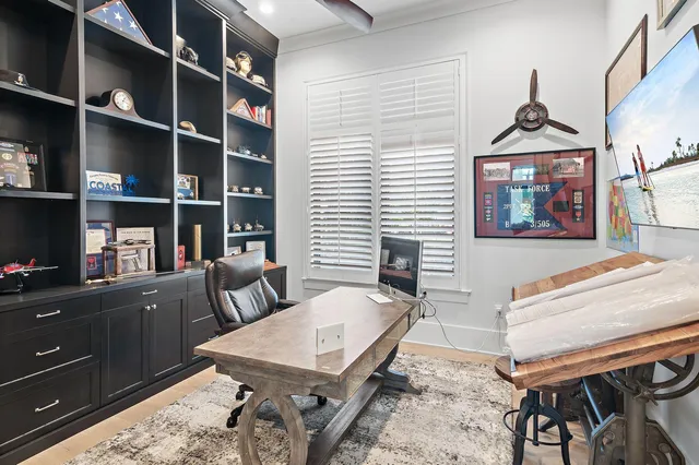 a workspace with furniture and window