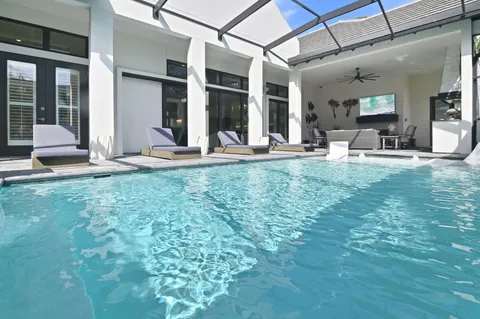a view of a house with backyard and porch