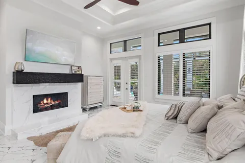 a bedroom with a bed and a fireplace