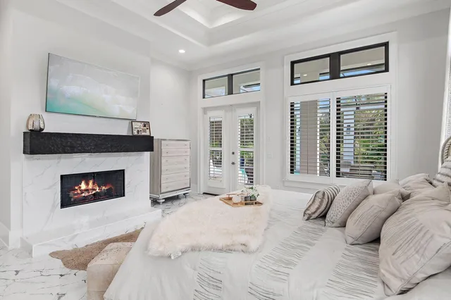 a bedroom with a bed and a fireplace