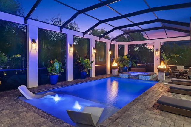 a view of swimming pool with seating space