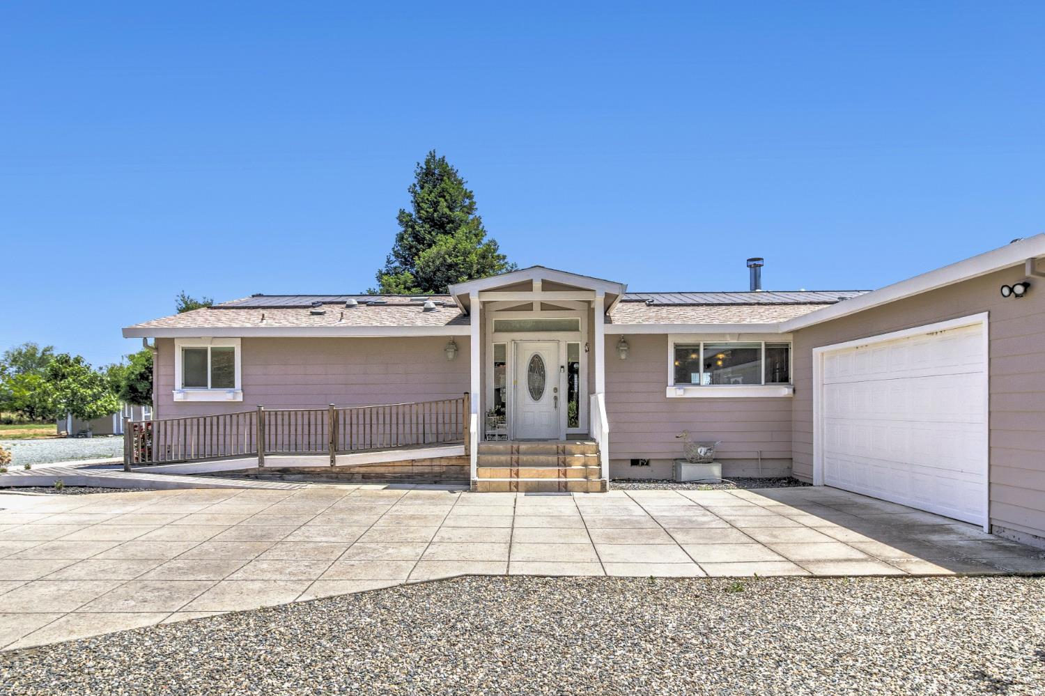 12390 Hobday Road Wilton, CA 95693 - Photo 2 of 92 a view of a house with a patio