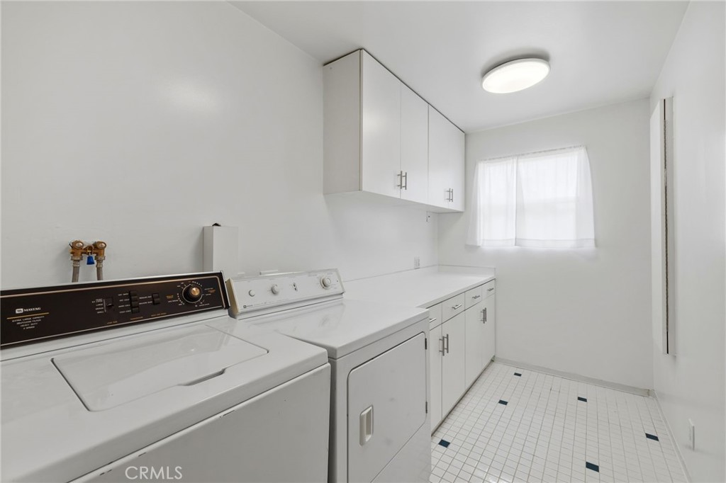 2407 North Keystone Street Burbank, CA 91504 - Photo 12 of 28 a utility room with cabinets washer and dryer