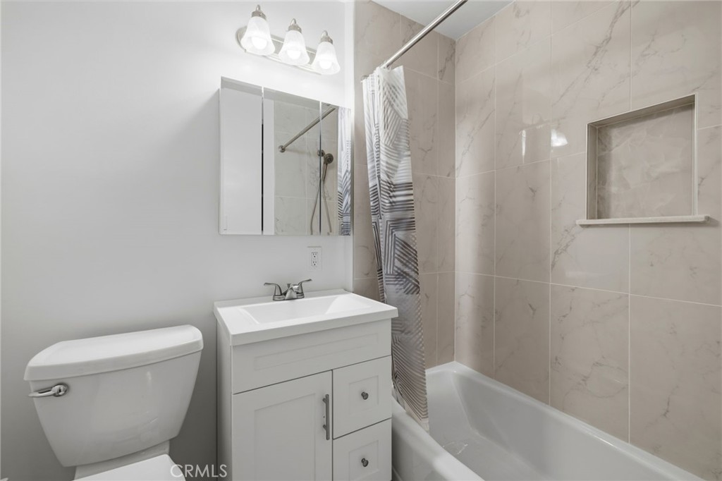 2407 North Keystone Street Burbank, CA 91504 - Photo 13 of 28 a bathroom with a sink a toilet and shower