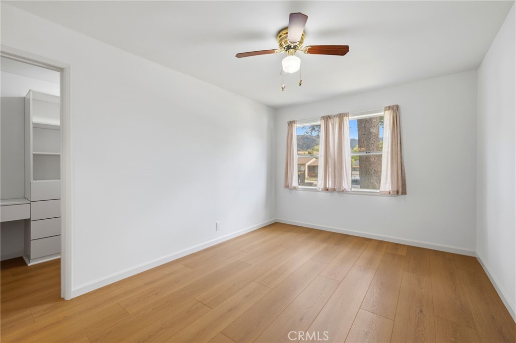 2407 North Keystone Street Burbank, CA 91504 - Photo 14 of 28 a view of an empty room with a window and wooden floor