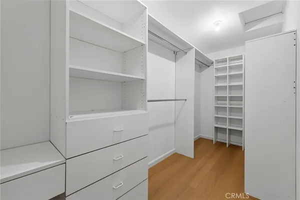 a view of an empty walk in closet