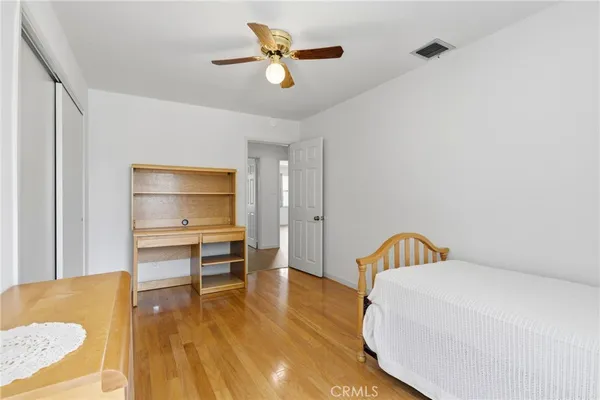 a living room with a bed furniture and a table