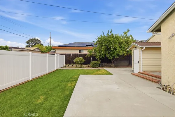 a view of a house with backyard and a slide