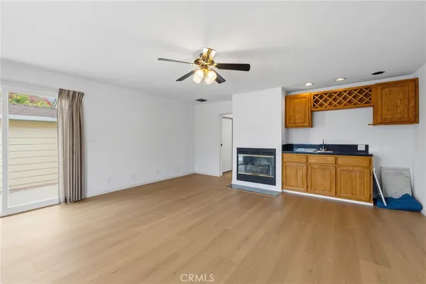 a view of a kitchen with microwave and cabinets