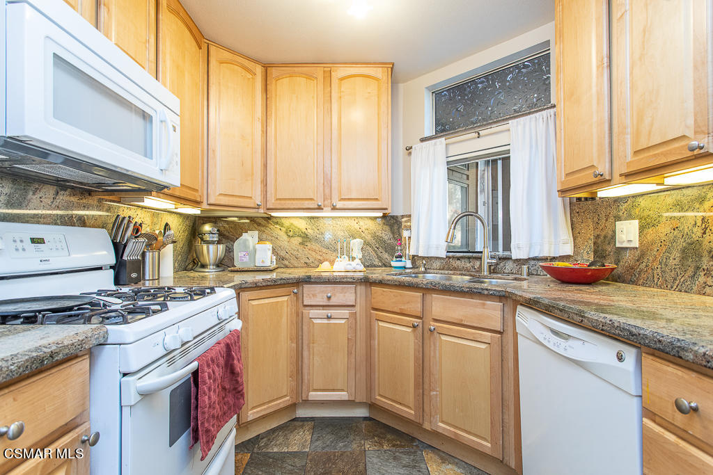 1772 Sinaloa Road, Unit 192 Simi Valley, CA 93065 - Photo 1 of 21 a kitchen with stainless steel appliances granite countertop a sink stove and cabinets