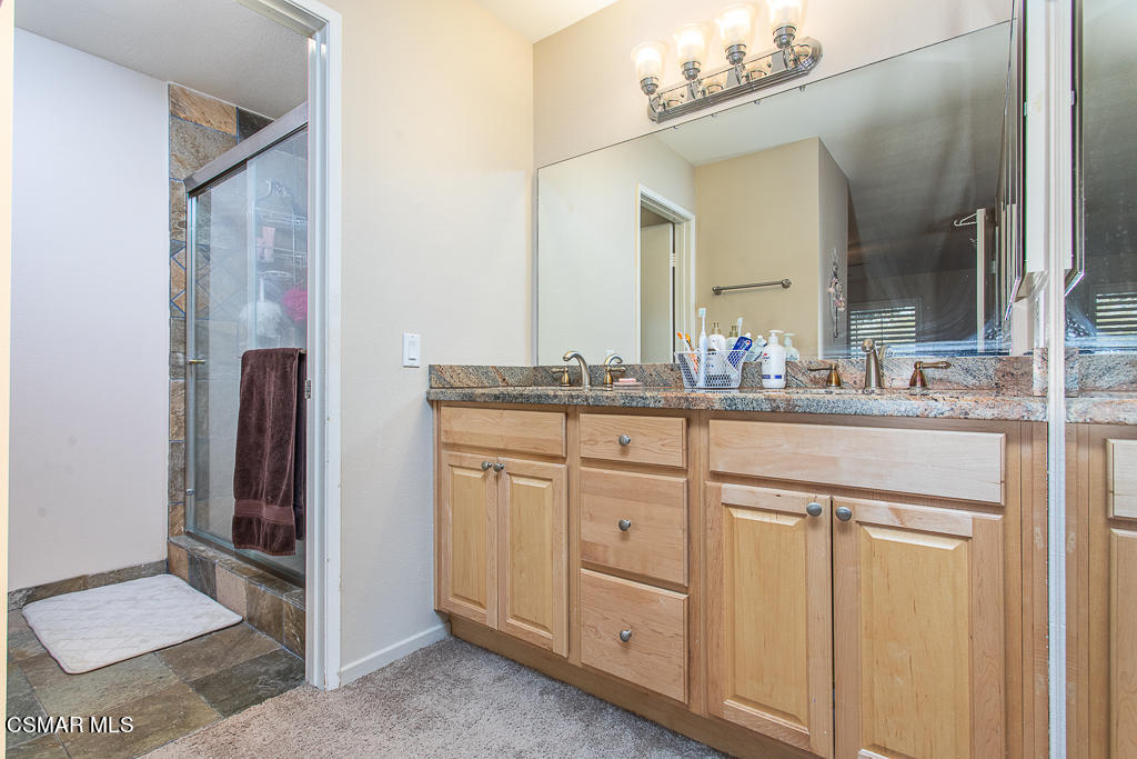 1772 Sinaloa Road, Unit 192 Simi Valley, CA 93065 - Photo 13 of 21 a bathroom with a sink and a mirror