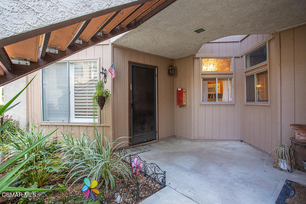 1772 Sinaloa Road, Unit 192 Simi Valley, CA 93065 - Photo 3 of 21 a view of entryway with flower pots