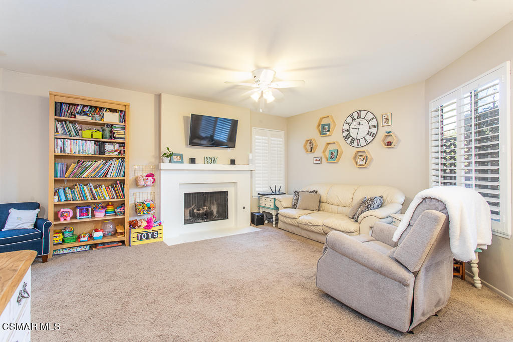 1772 Sinaloa Road, Unit 192 Simi Valley, CA 93065 - Photo 5 of 21 a living room with fireplace furniture and a flat screen tv
