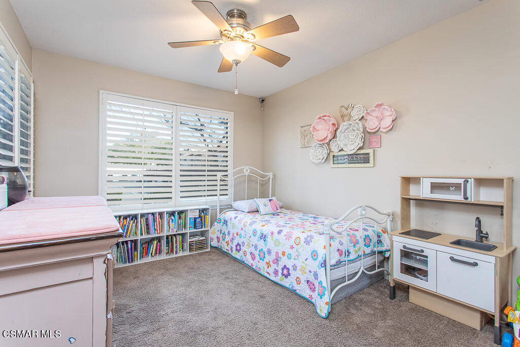 1772 Sinaloa Road, Unit 192 Simi Valley, CA 93065 - Photo 10 of 21 a bedroom with a bed and a chandelier