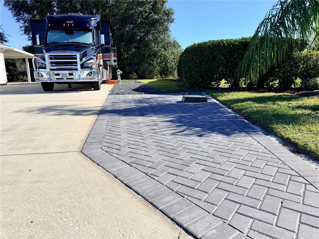 9357 Southeast 49th Terrace Webster, FL 33597 - Photo 11 of 39 a view of a street with houses