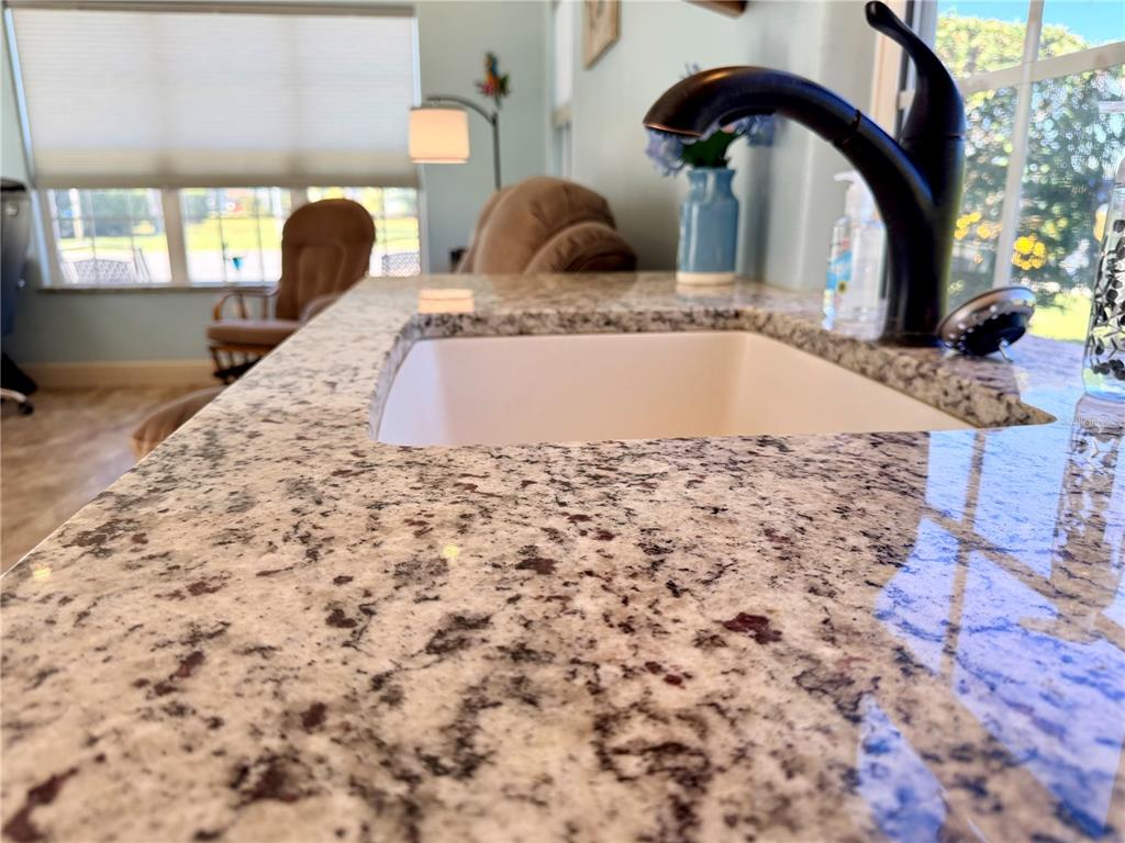 9357 Southeast 49th Terrace Webster, FL 33597 - Photo 19 of 39 a view of a bath tub sitting in a kitchen