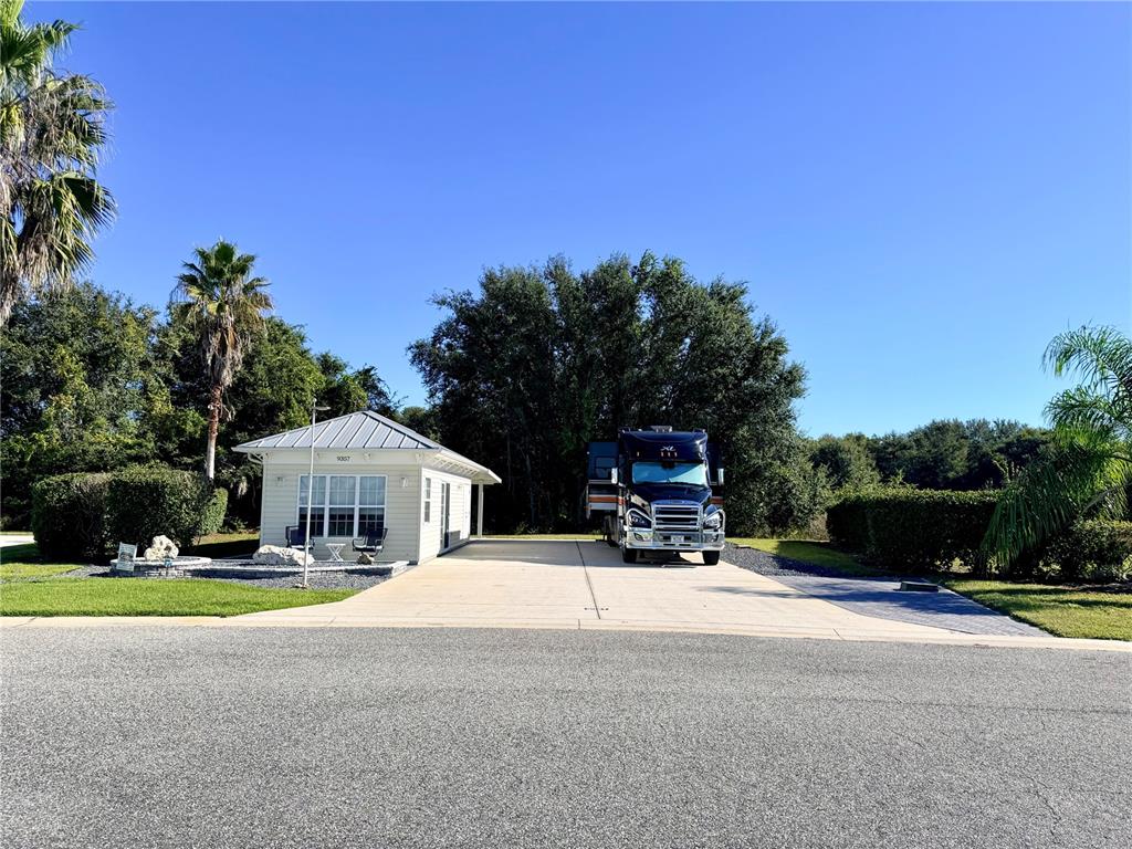 9357 Southeast 49th Terrace Webster, FL 33597 - Photo 2 of 39 a view of a house with swimming pool and yard
