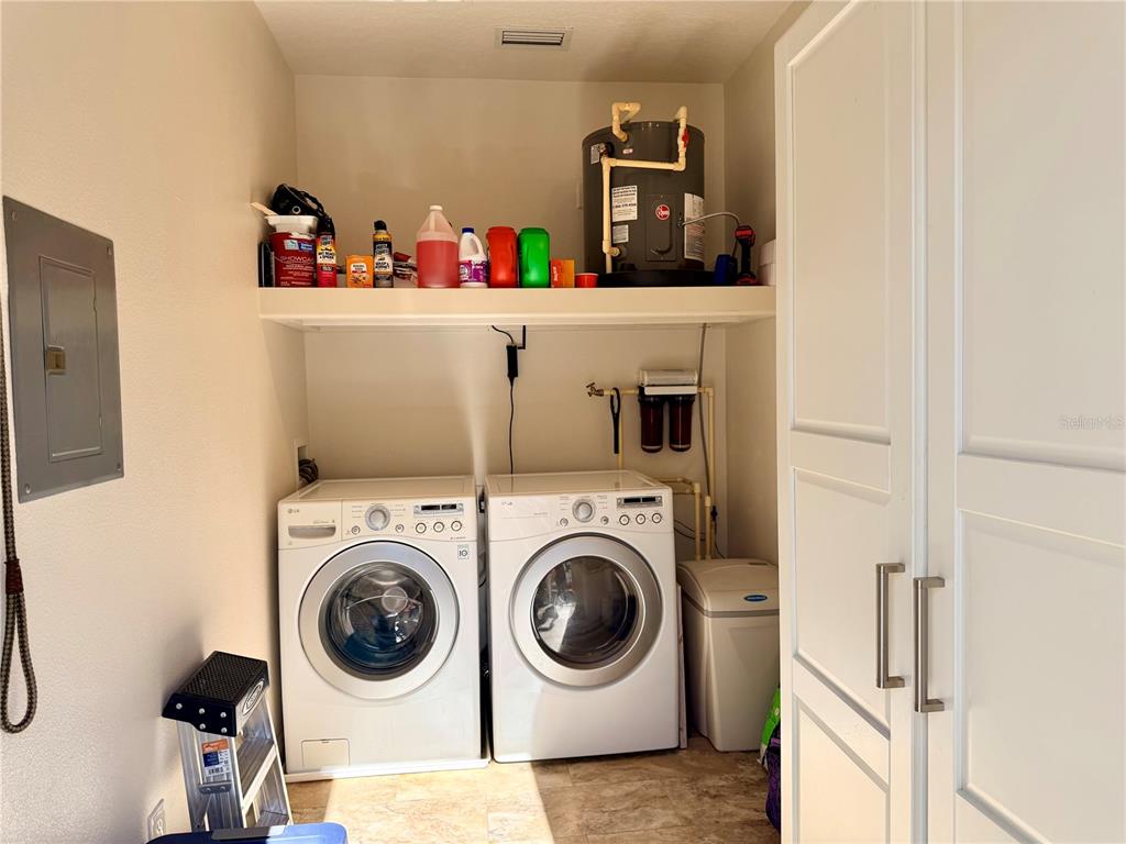 9357 Southeast 49th Terrace Webster, FL 33597 - Photo 24 of 39 a utility room with dryer and washer