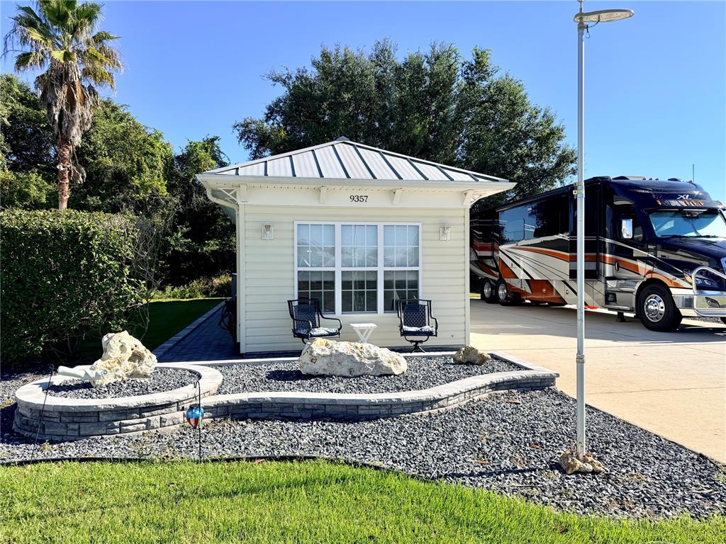 9357 Southeast 49th Terrace Webster, FL 33597 - Photo 3 of 39 a front view of a house with a yard