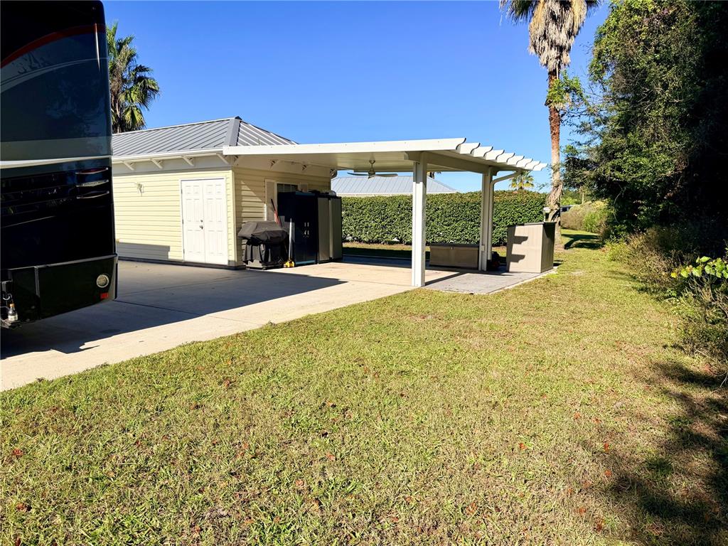 9357 Southeast 49th Terrace Webster, FL 33597 - Photo 8 of 39 a view of a house with a yard and porch