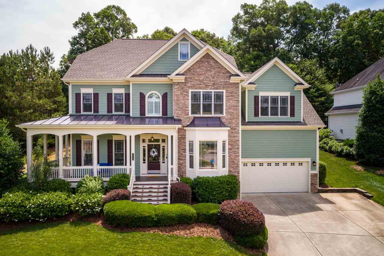 An inviting front porch and adjoining side porch welcome you to this custom-built home. Exterior freshly painted in 2017. Two car garage and convenient parking pad. Welcome Home!