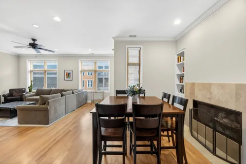 a dining room with furniture and window
