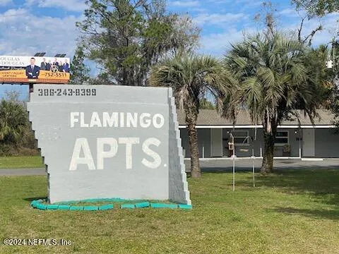 a view of outdoor space with a garden and trees
