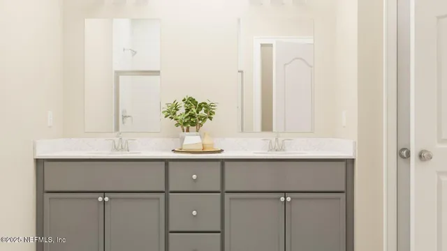 a dining room with furniture and a potted plant