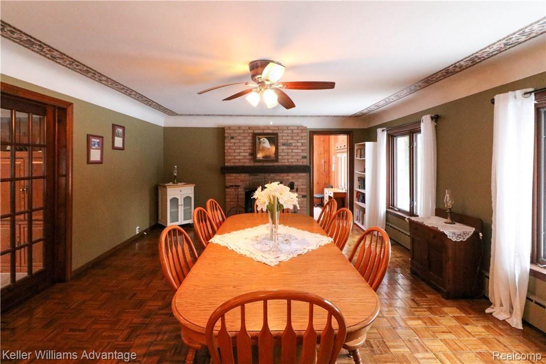 4679 Hegel Road Goodrich, MI 48438 - Photo 16 of 41 Kitchen opens up to large dining room with parquet flooring!