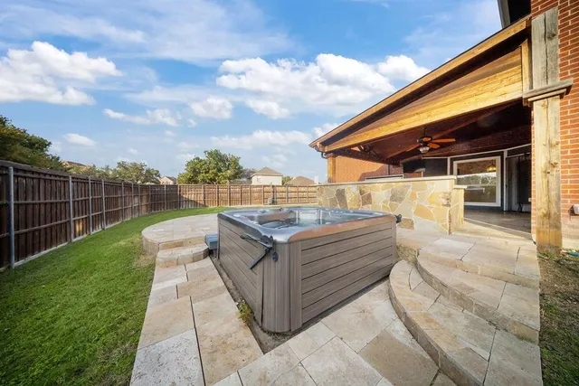 a view of a backyard with sitting area