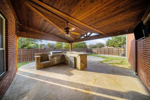 a view of a backyard with sitting area