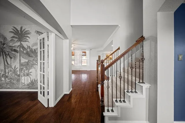 a view of staircase with wooden floor and stairs