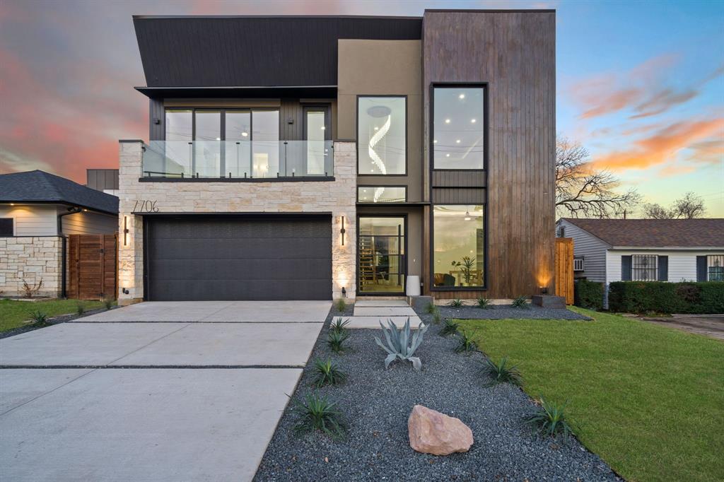 7706 Roper Street Dallas, TX 75209 - Photo 1 of 1 a front view of a house with a yard and garage