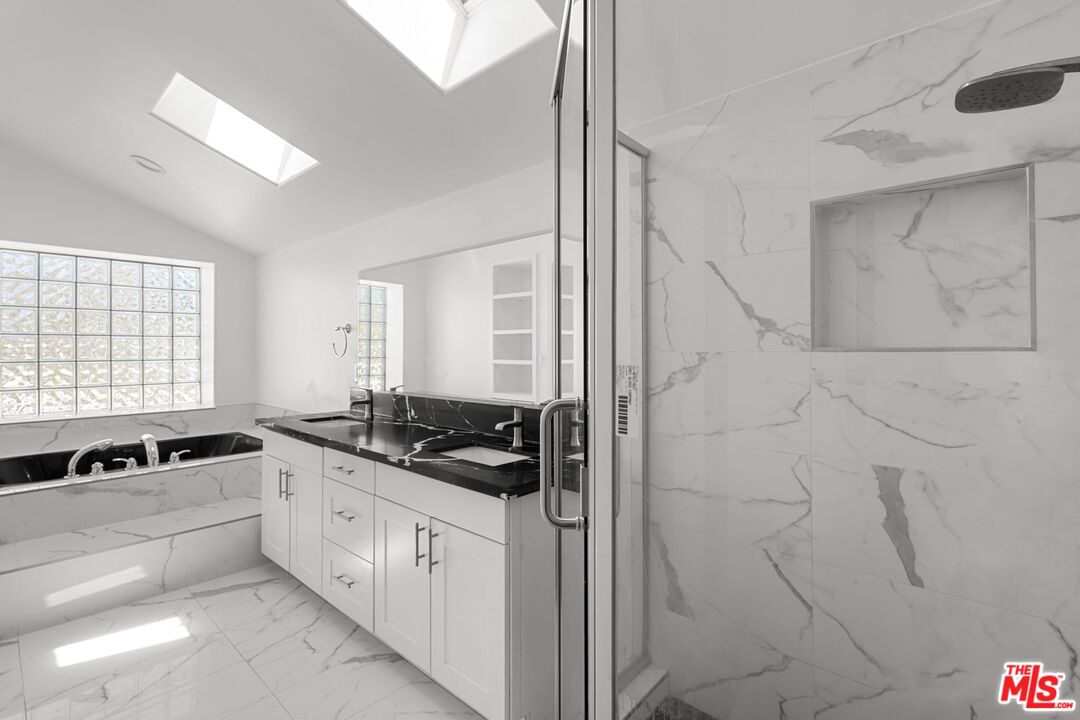 18657 Kirkcolm Lane Porter Ranch, CA 91326 - Photo 13 of 22 a kitchen with a sink and cabinets