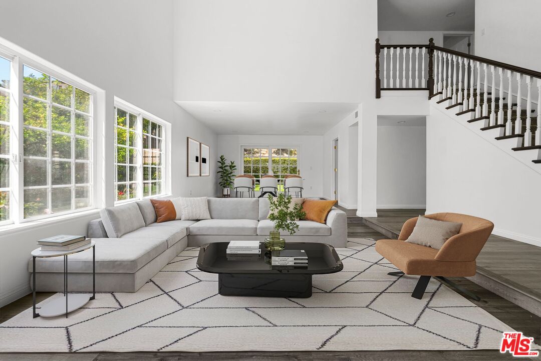 18657 Kirkcolm Lane Porter Ranch, CA 91326 - Photo 4 of 22 a living room with furniture and a large window