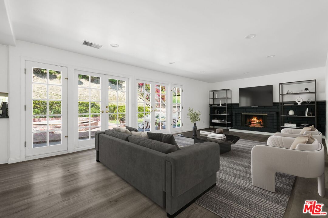 18657 Kirkcolm Lane Porter Ranch, CA 91326 - Photo 8 of 22 a living room with furniture and a large window