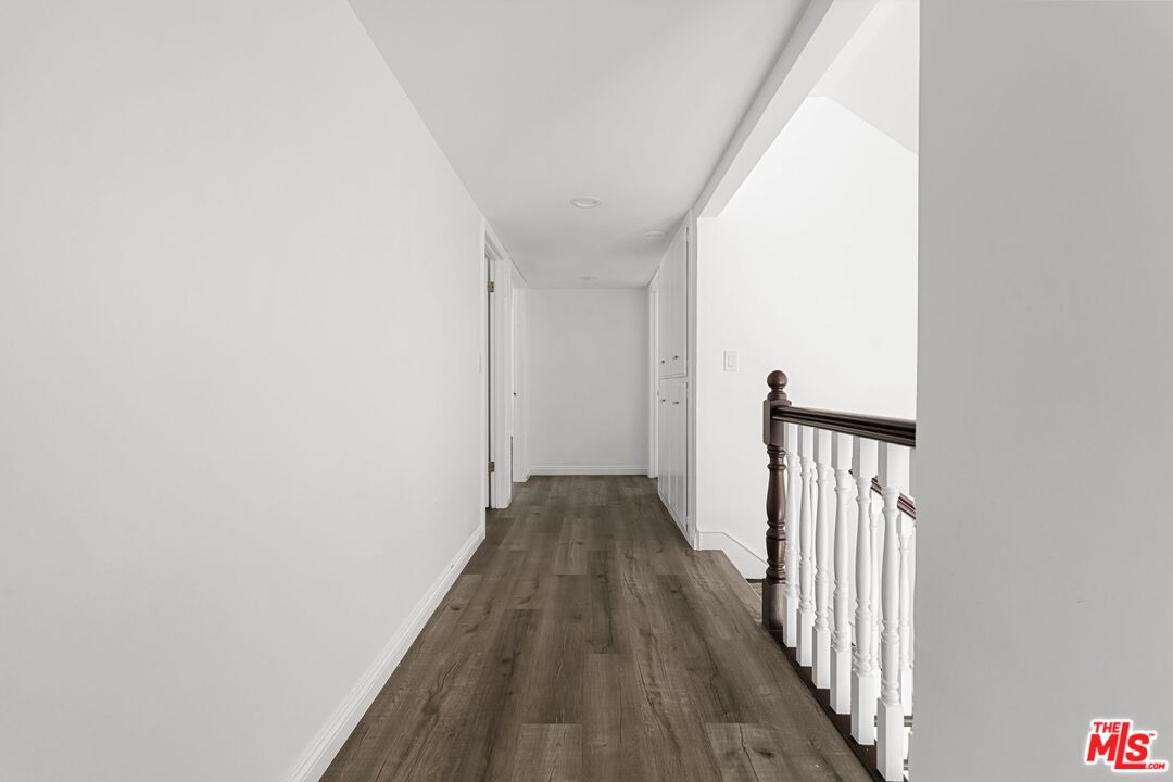 18657 Kirkcolm Lane Porter Ranch, CA 91326 - Photo 10 of 22 a view of a hallway with wooden floor