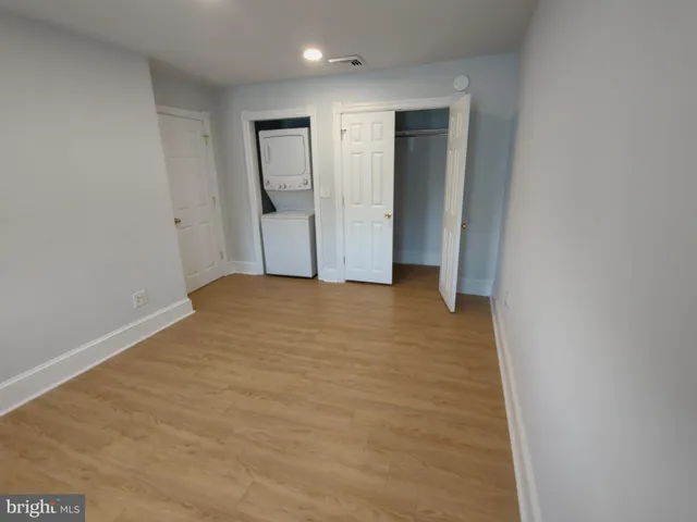 a view of hallway with wooden floor