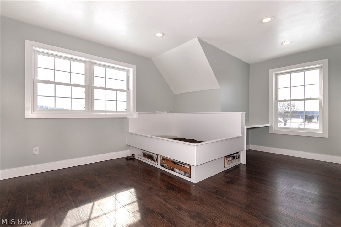 18919 Ravenna Road Chagrin Falls, OH 44023 - Photo 20 of 48 Bedroom 3 with wood flooring and a custom built bedframe with storage drawers underneath.