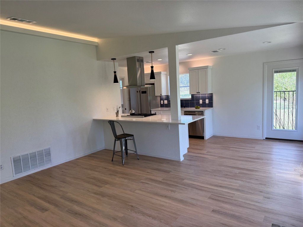 7313 Rhett Place Austin, TX 78744 - Photo 11 of 38 a view of a kitchen and dining room