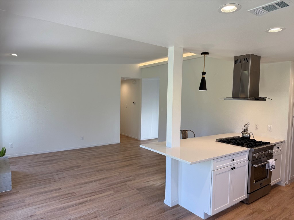 7313 Rhett Place Austin, TX 78744 - Photo 12 of 38 a kitchen with a sink and a stove top oven