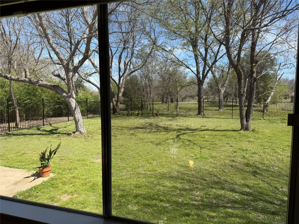 7313 Rhett Place Austin, TX 78744 - Photo 18 of 38 a view of yard with swimming pool