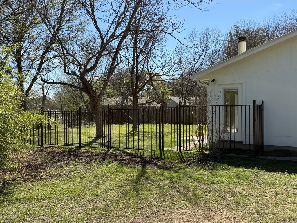 7313 Rhett Place Austin, TX 78744 - Photo 23 of 38 a view of a backyard with fence