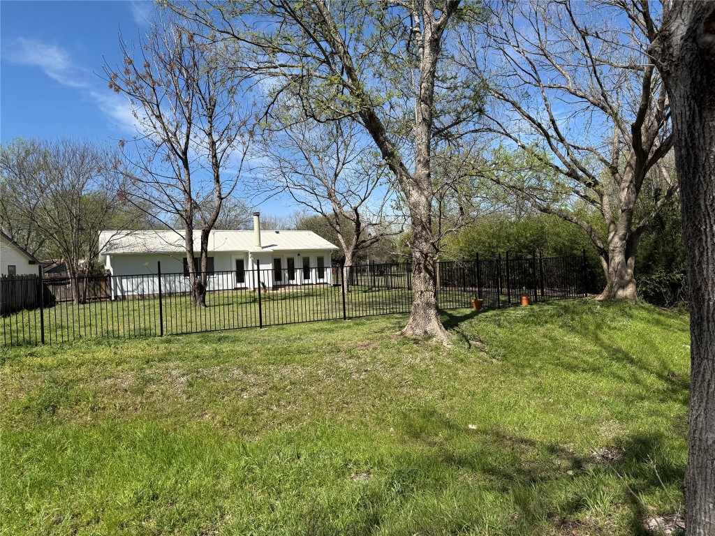 7313 Rhett Place Austin, TX 78744 - Photo 25 of 38 a view of a house with a backyard