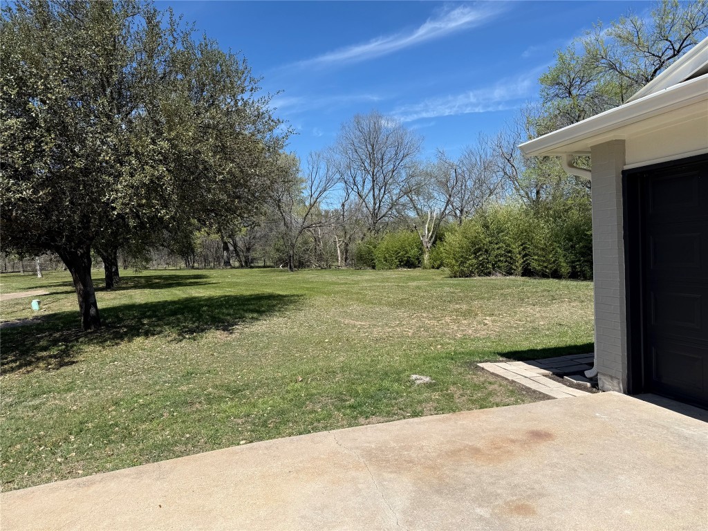 7313 Rhett Place Austin, TX 78744 - Photo 29 of 38 a view of a garden with a bench